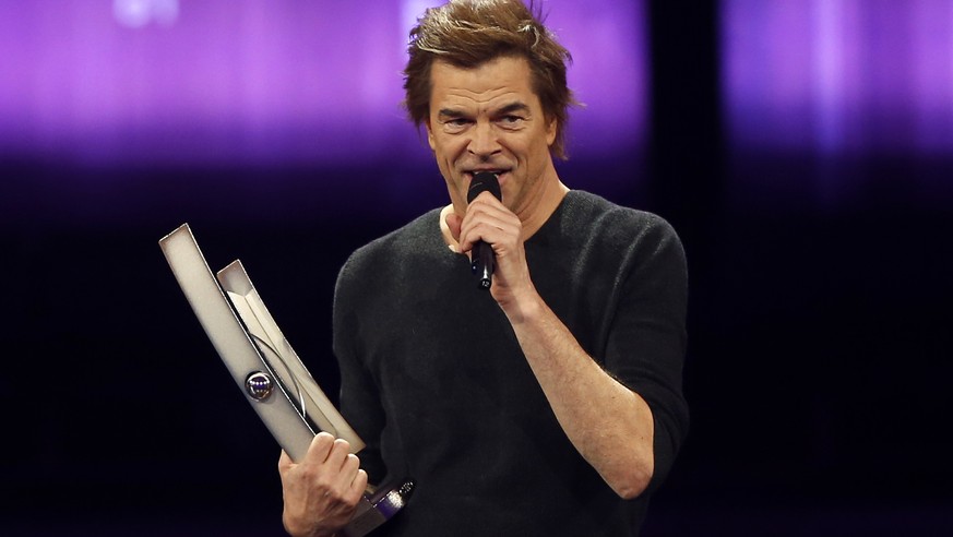 Campino of the Toten Hosen receives the &quot;national rock&quot; award before holding a speech against extremism during the 2018 Echo Music Awards ceremony Thursday, April 12, 2018 in Berlin. (Axel S ...