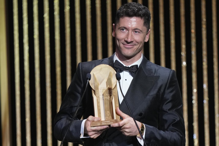 FC Barcelona&#039;s Robert Lewandowski celebrates after winning the Gerd Muller Award during the 66th Ballon d&#039;Or ceremony at Theatre du Chatelet in Paris, France, Monday, Oct. 17, 2022. (AP Phot ...