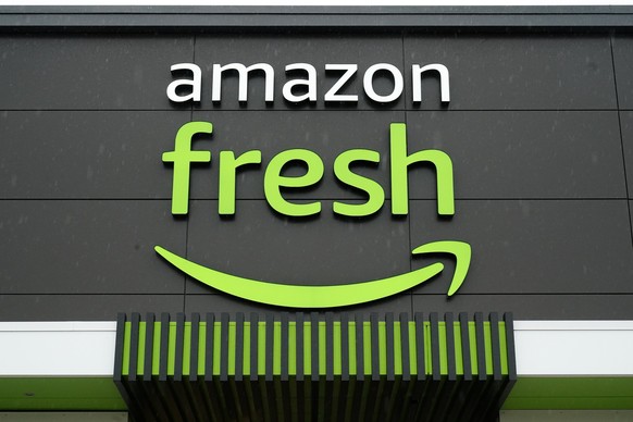 FILE - An Amazon Fresh grocery store stands in Warrington, Pa., on Feb. 4, 2022. In an email to Prime members Friday, Jan. 27, 2023, Amazon said that they are axing free grocery delivery for Prime mem ...