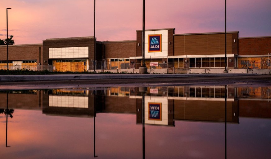 MINNEAPOLIS, MN - JUNE 21: An Aldi grocery store is boarded up and closed near the Third Police Precinct Station on June 21, 2020 in Minneapolis, Minnesota. Over 1500 buildings were damaged during the ...