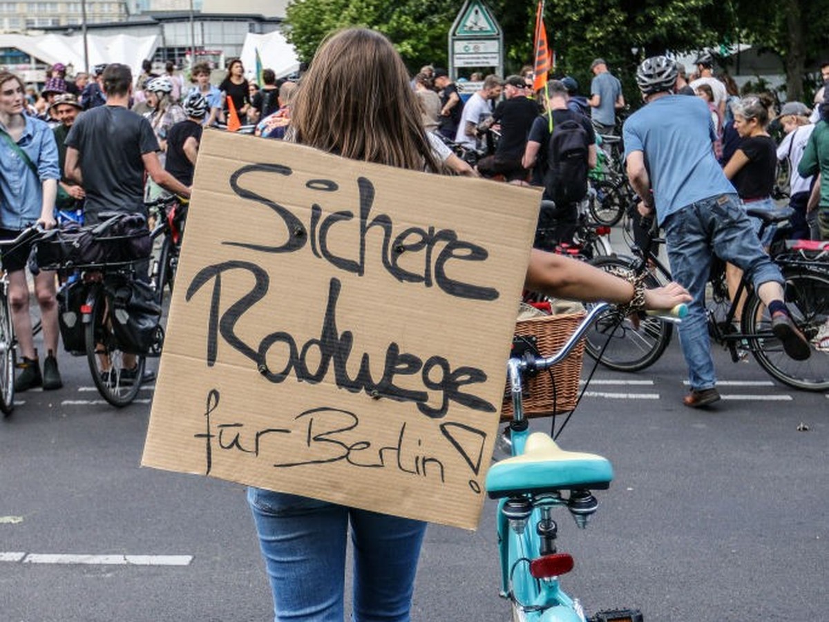 BERLIN, GERMANY - JULY 2: A demonstrator with a banner reading "Secure bike-lanes for Berlin" as activists protesting against the city government's halt on new bicycle lanes demonstrate ...