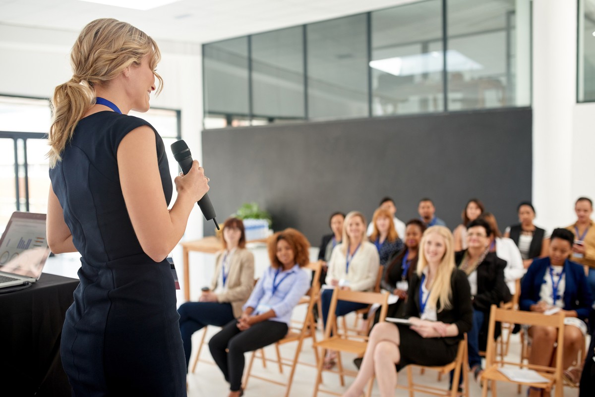 Shot of a young businesswoman delivering a presentation at a conference