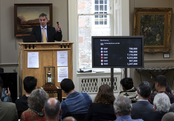 Bonhams auctioneer Charles Graham-Campbell during the auction for the bottle of the world&#039;s rarest and most valuable whisky, The Macallan Valerio Adami, at the Bonhams Whisky Sale at their Edinbu ...