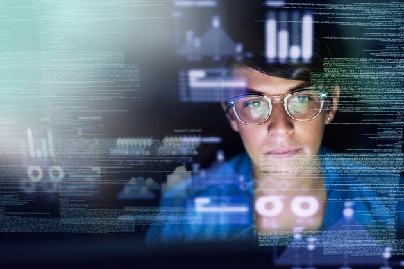 Cropped shot of a young computer programmer looking through data