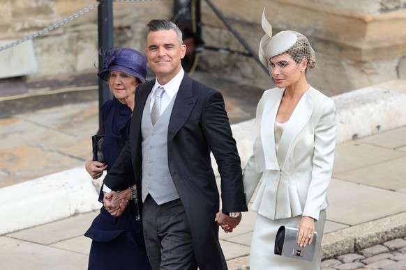 Robbie Williams and Ayda Field arrive for the wedding of Princess Eugenie to Jack Brooksbank at St George's Chapel in Windsor Castle, Windsor, Britain, October 12, 2018. Aaron Chown/Pool via REUTERS