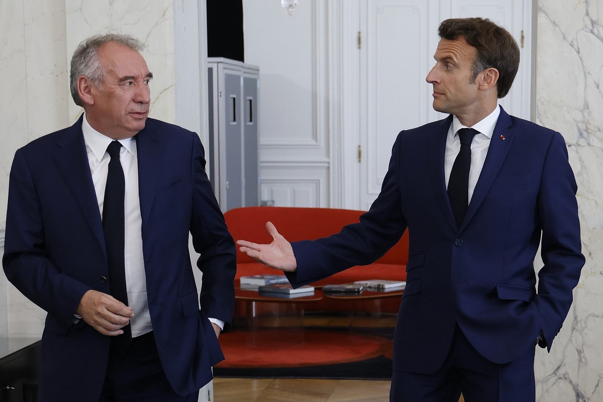FILE - French President Emmanuel Macron, right, meets French centrist party MoDem (Mouvement Democrate) leader Francois Bayrou at the Elysee Palace in Paris, France, Tuesday, June 21, 2022. French Pre ...
