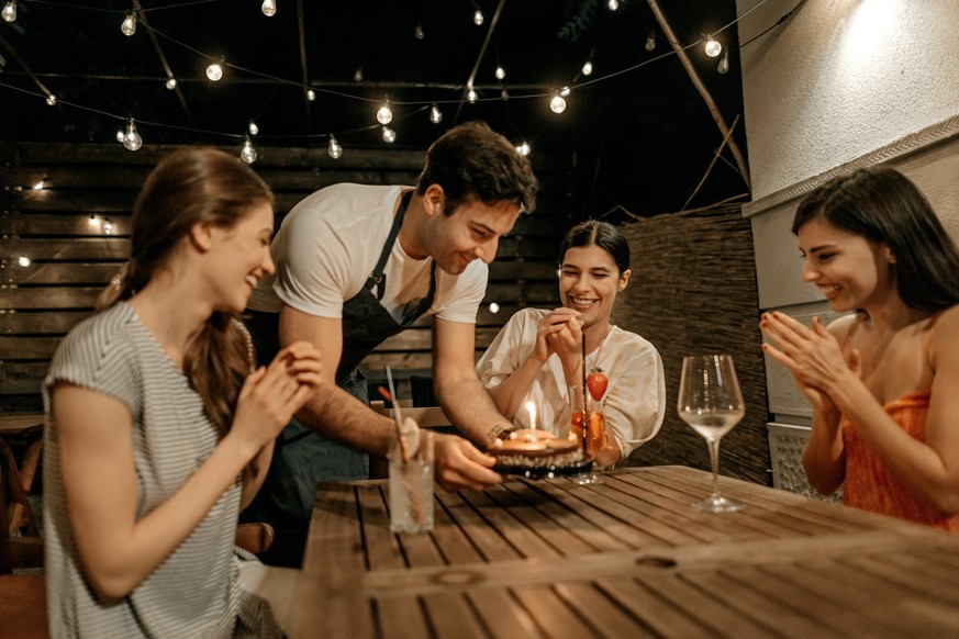 Young women celebrating a birthday at a restaurant