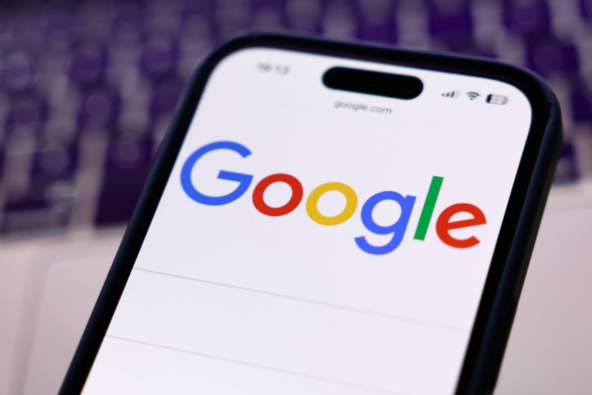 American Social Media And IT Companies Photo Illustrations A laptop keyboard and Google website displayed on a phone screen are seen in this illustration photo taken in Krakow, Poland on March 12, 202 ...