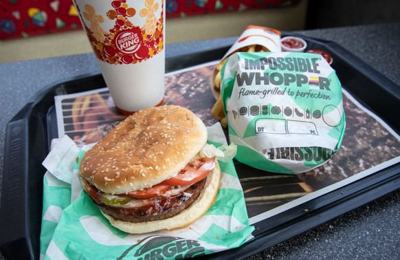 NEW YORK, NY - AUGUST 8: In this photo illustration, the new Impossible Whopper sits on a table at a Burger King restaurant on August 8, 2019 in the Brooklyn borough of New York City. On Thursday, Bur ...