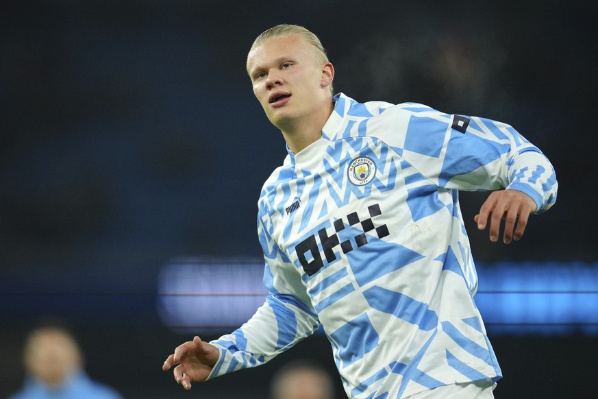 Manchester City's Erling Haaland warms up prior to the English League Cup soccer match between Manchester City and Liverpool at Etihad stadium in Manchester, England, Thursday, Dec. 22, 2022. (AP Phot ...