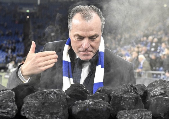 FILE-In this Dec. 19, 2018 file photo Schalke boss Clemens Toennies smells steaming coal on a trolley beside the pitch prior the Bundesliga soccer match between FC Schalke 04 and Bayer Leverkusen in G ...