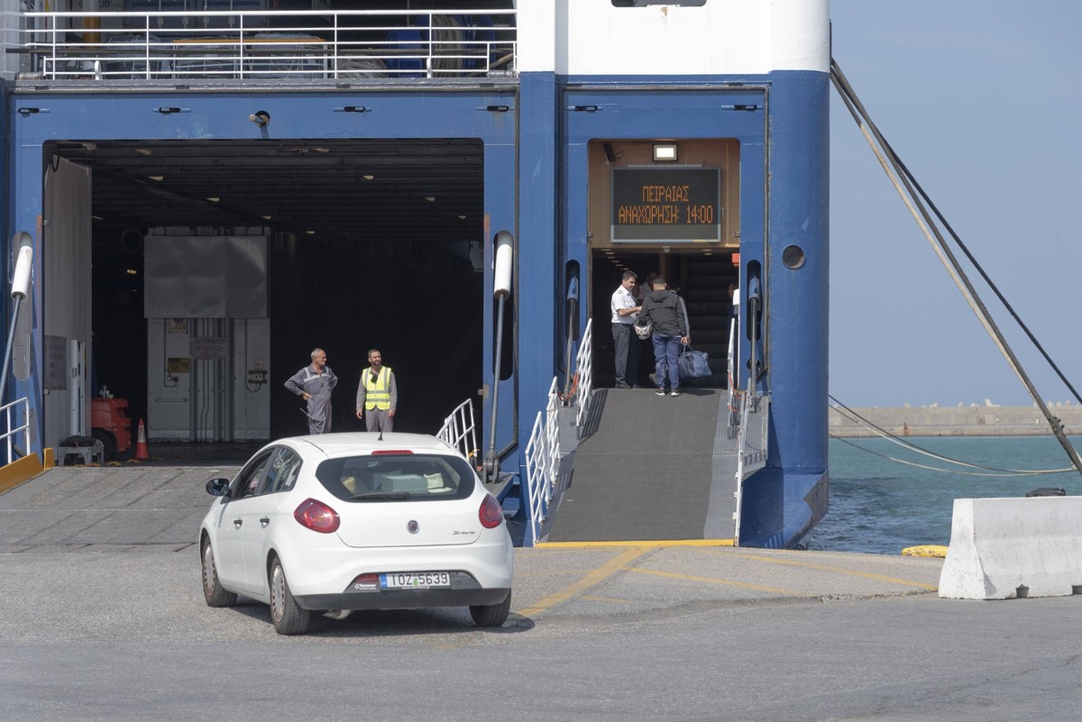 Heraklion, Crete, Greece, Vehicle and passengers loading onto a roro ferry in the port of Heraklion, Crete. Heraklion, Crete, Greece, Vehicle and passengers loading onto a roro ferry in the port of He ...
