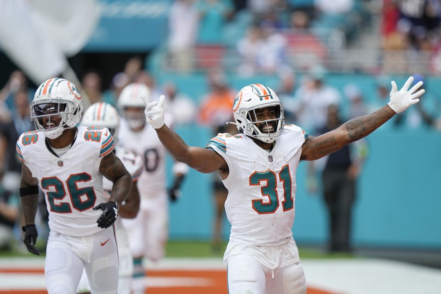 Miami Dolphins running back Raheem Mostert (31) celebrates scoring a touchdown during the second half of an NFL football game against the New England Patriots, Sunday, Oct. 29, 2023, in Miami Gardens, ...