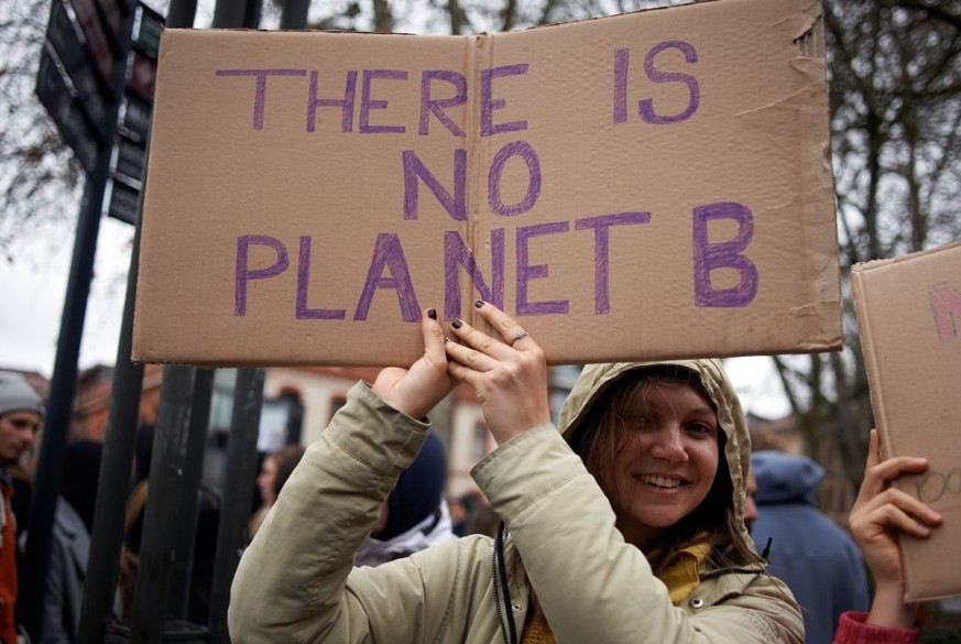 A woman is holding a placard reading &#039;&#039;There is no Planet B&#039;&#039; as Youth For Climate and other collectives and NGOs take to the streets of Toulouse, France, on March 11th, 2023, to d ...