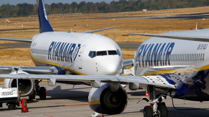 FILE PHOTO: Ryanair aircraft parked on the tarmac at Weeze airport near the German-Dutch border during a wider European strike of Ryanair airline crew in protest over slow progress in negotiating a co ...