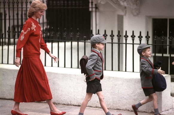 Princess Diana death anniversary. File photo dated 15/09/89 of Diana, Princess of Wales following her sons Prince Harry (right), then five years old, and Prince William, then seven, on Harry&#039;s fi ...