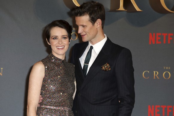 FILE - In this Tuesday, Nov. 21, 2017 file photo, actors Claire Foy, left, and Matt Smith pose for photographers on arrival at the premiere of the series 'The Crown, Season 2' in central London. Produ ...