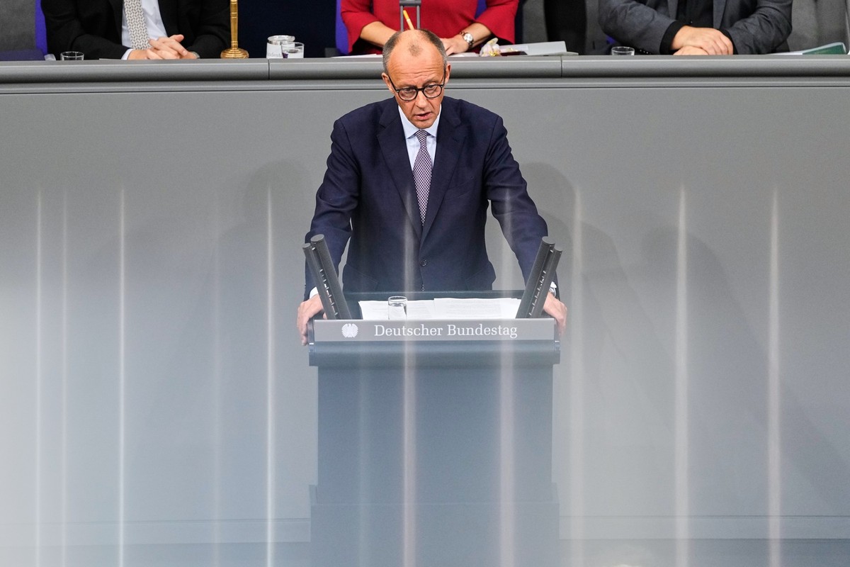 German Chancellor Friedrich Merz addresses the German parliament during a debate at the Reichstag in Berlin, Germany, Thursday, Oct. 16, 2025. (AP Photo/Markus Schreiber)