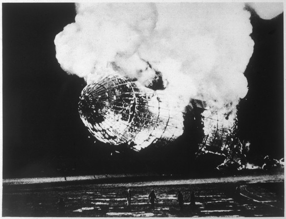 Hindenburg airship disaster, New Jersey, USA Scene at the Hindenburg airship disaster. The German passenger airship explodes into a ball of fire as it lands in New Jersey, USA. Of the 97 people on boa ...