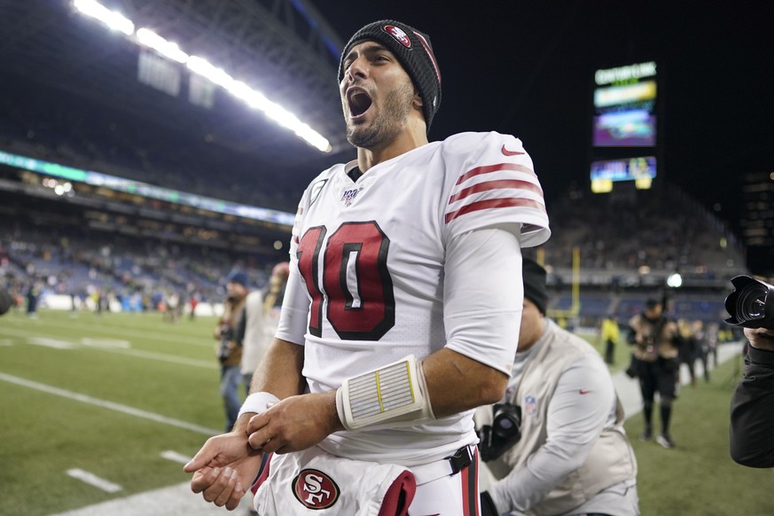 December 29, 2019; Seattle, Washington, USA; San Francisco 49ers quarterback Jimmy Garoppolo (10) celebrates after the game against the San Francisco 49ers at CenturyLink Field. Mandatory Credit: Kyle ...