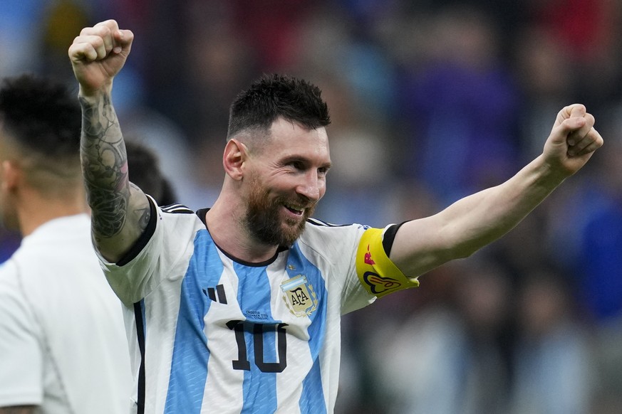 Argentina's Lionel Messi celebrates defeating Croatia 3-0 in a World Cup semifinal soccer match at the Lusail Stadium in Lusail, Qatar, Tuesday, Dec. 13, 2022. (AP Photo/Natacha Pisarenko)