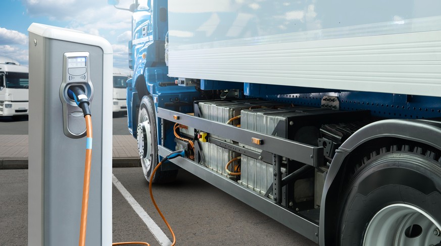 Electric truck batteries are charged from the charging station. Concept