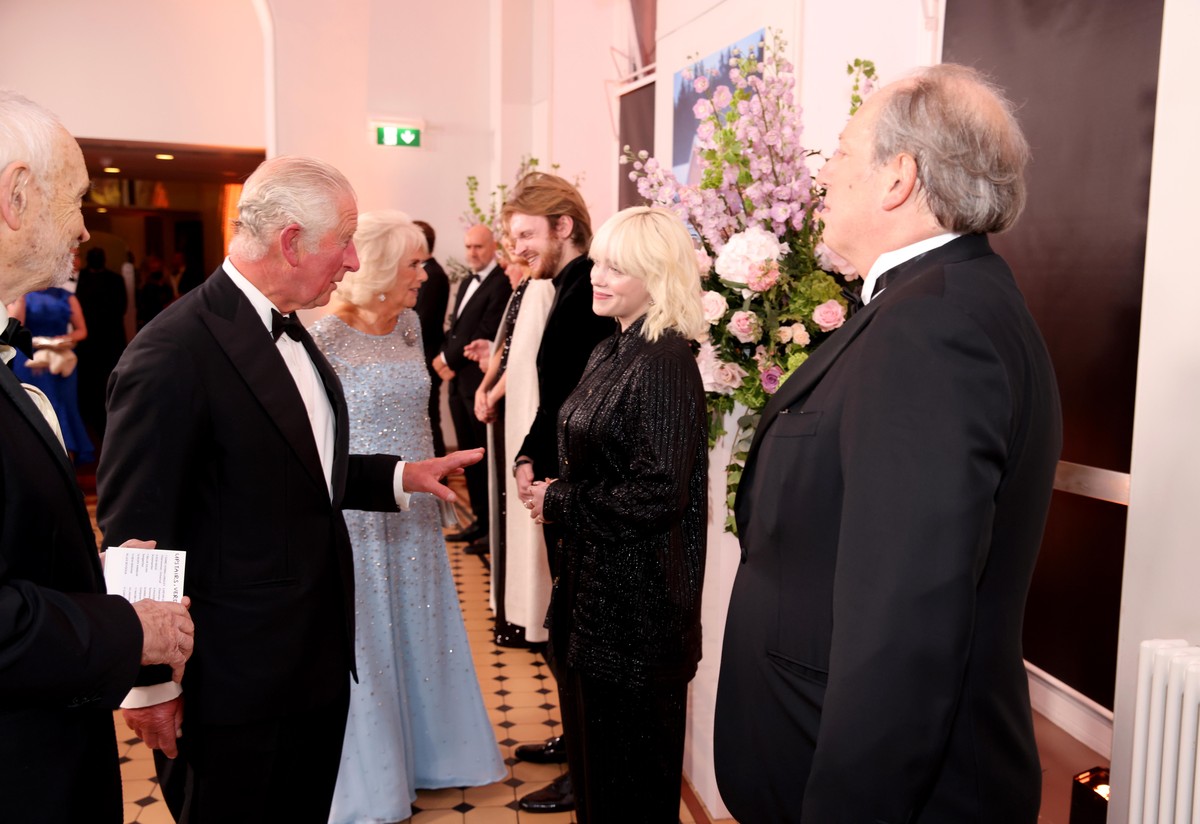 LONDON, ENGLAND - SEPTEMBER 28: Prince Charles, Prince of Wales meet musician Billie Eilish at the World Premiere of &quot;NO TIME TO DIE&quot; at the Royal Albert Hall on September 28, 2021 in London ...