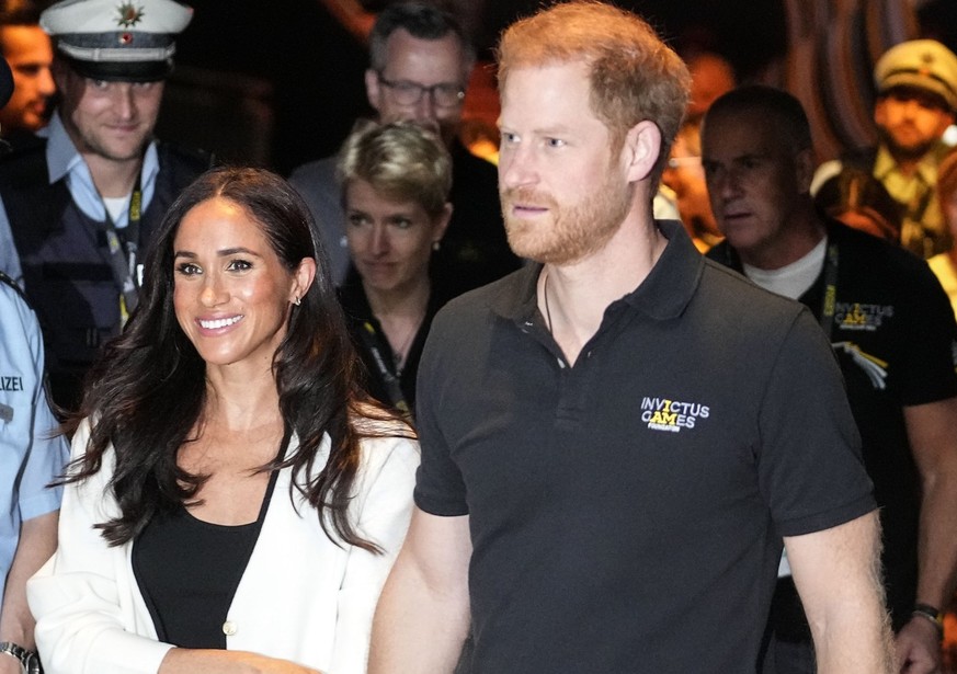 FILE - Britain&#039;s Prince Harry, right, and Meghan, Duchess of Sussex, arrive to a wheelchair basketball match at the Invictus Games in Duesseldorf, Germany, Sept. 13, 2023. Prince Harry and his wi ...