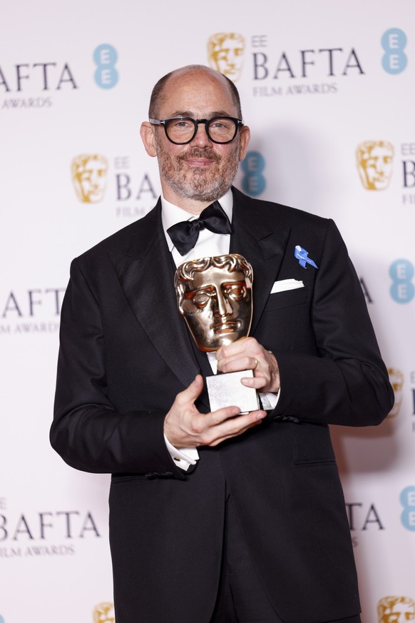 Edward Berger, winner of the film not in the english language award for &#039;All Quiet on the Western Front&#039;, poses for photographers at the 76th British Academy Film Awards, BAFTA&#039;s, in Lo ...