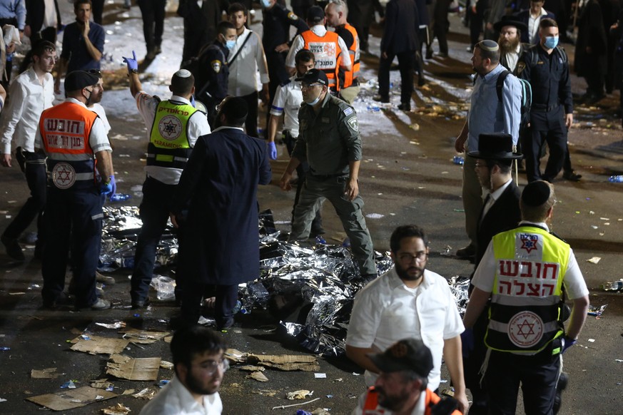 210430 -- JERUSALEM, April 30, 2021 -- Rescuers work on the site of a stampede accident in Mount Meron, Israel, April 30, 2021. An apparent stampede occurred at an overcrowded Israeli festival after m ...