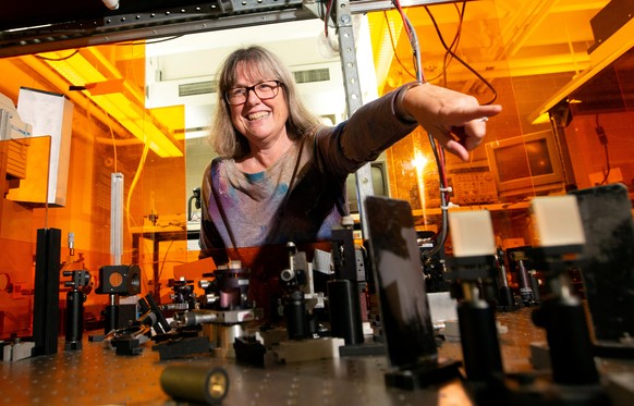 Donna Strickland, an associate professor at the University of Waterloo, is photographed in her lab following a news conference, after winning the Nobel Prize for Physics, at the university in Waterloo ...