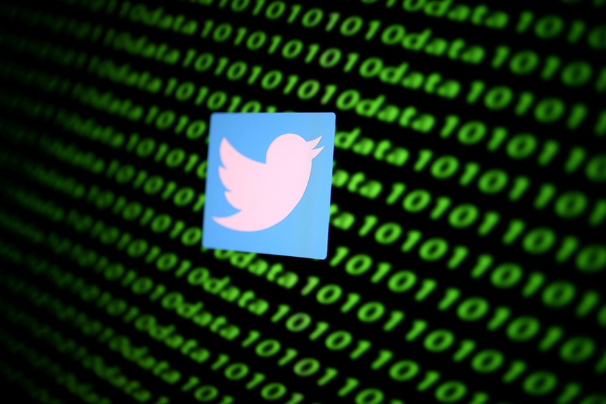FILE PHOTO: The Twitter logo and binary cyber codes are seen in this illustration taken November 26, 2019. REUTERS/Dado Ruvic/Illustration/File Photo