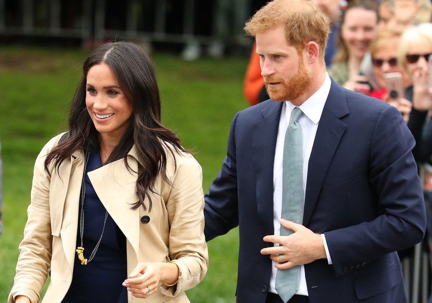 MELBOURNE, AUSTRALIA - OCTOBER 18: Prince Harry, Duke of Sussex and Meghan, Duchess of Sussex meet members of the public before attending an official reception at Government House on October 18, 2018  ...