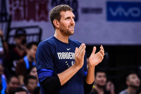 Dirk Nowitzki of Dallas Mavericks reacts before the Shenzhen match of the NBA Basketball Herren USA China Games against Philadelphia 76ers in Shenzhen city, south China s Guangdong province, 8 October ...