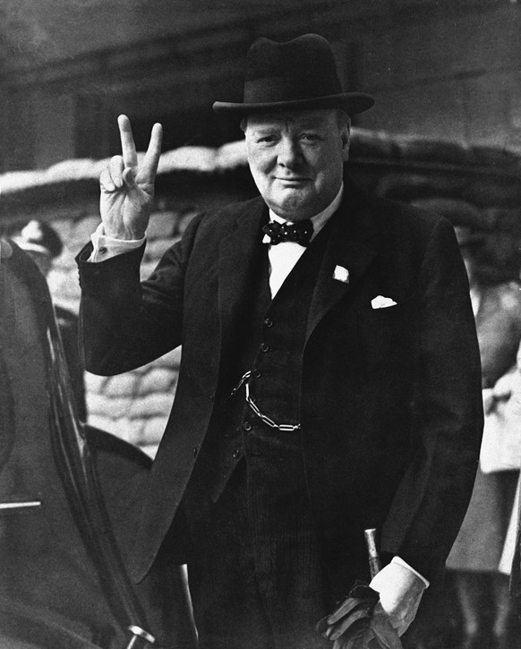 British Prime Minister Winston Churchill gives a &quot;Victory Salute&quot; Aug. 27, 1941. (AP Photo) |