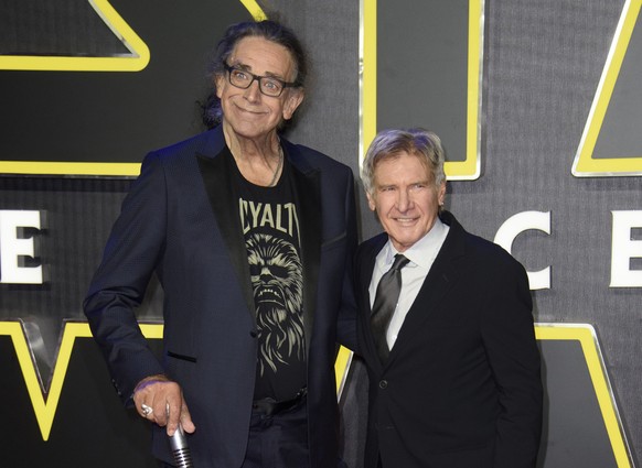 FILE - This Dec. 16, 2015 file photo shows Peter Mayhew, left, and Harrison Ford at the European premiere of the film 'Star Wars: The Force Awakens ' in London. Mayhew, who played the rugged, beloved  ...