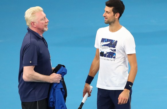 BRISBANE, AUSTRALIA - JANUARY 02: Boris Becker and Novak Djokovic of Serbia talk during a practice session ahead of the 2020 ATP Cup Group Stage at Pat Rafter Arena on January 02, 2020 in Brisbane, Au ...