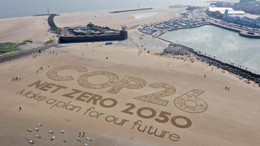 WIRRAL, MERSEYSIDE - MAY 31: A giant sand artwork adorns New Brighton Beach to highlight global warming and the forthcoming Cop26 global climate conference on May 31, 2021 in Wirral, Merseyside. COP26 ...