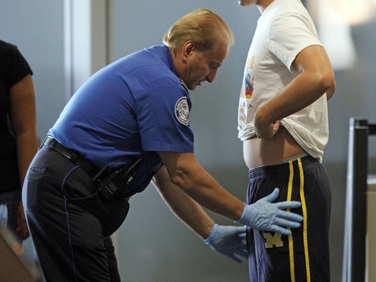 Nov. 24, 2010 - West Palm Beach, FL, USA - 112410 (Lannis Waters/The Palm Beach Post) WEST PALM BEACH -- A passenger at Palm Beach International Airport undergoes a patdown by a TSA officer Wednesday ...