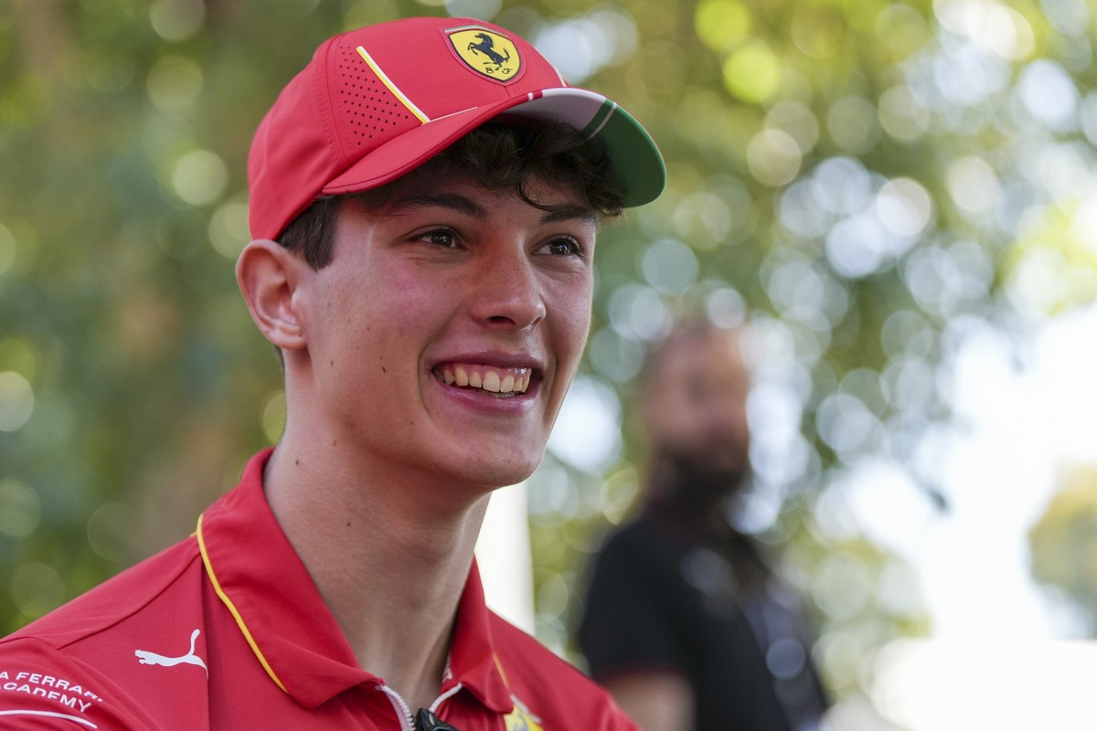 Ferrari reserve driver Oliver Bearman of Britain is interviewed outside his team garage ahead of the Australian Formula One Grand Prix at Albert Park, Melbourne, Australia, Thursday, March 21, 2024. ( ...