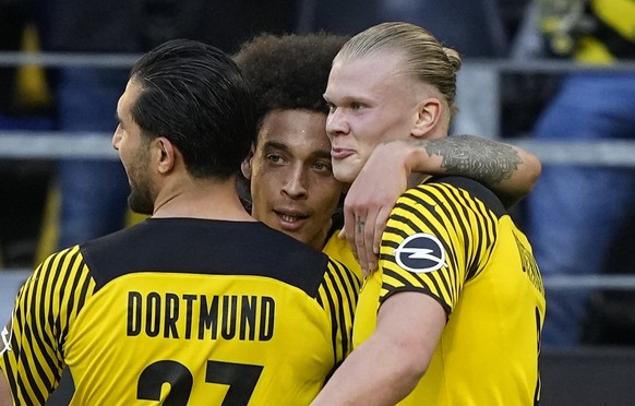 Dortmund's Axel Witsel, center celebrates after scoring his side's third goal with Dortmund's Erling Haaland, right, and Dortmund's Emre Can, left, during the German Bundesliga soccer match between Bo ...