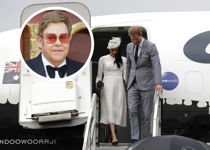 SUVA, FIJI - OCTOBER 23: Prince Harry, Duke of Sussex and Meghan, Duchess of Sussex disembark from their plane on their arrival in Suva on October 23, 2018 in Suva, Fiji. The Duke and Duchess of Susse ...