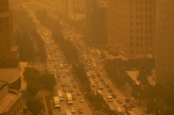Traffic moves along Wednesday, June 7, 2023, in New York, amidst smokey haze from wildfires in Canada. Smoke from Canadian wildfires poured into the U.S. East Coast and Midwest on Wednesday, covering  ...
