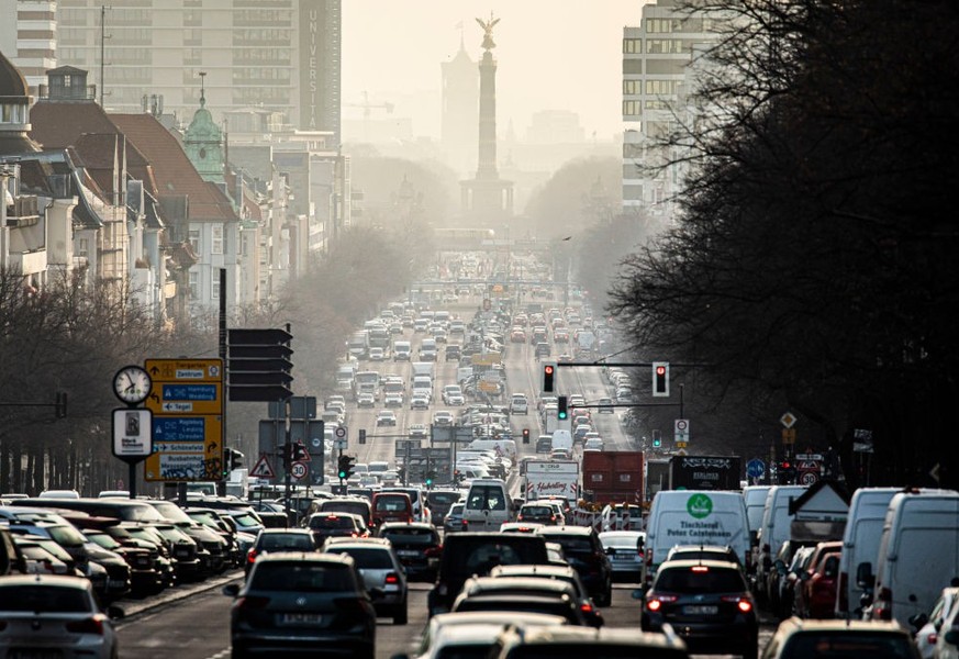 BERLIN, GERMANY - FEBRUARY 25: The morning rush hour on the street Bismarckstrasse is pictured during morning light on February 25, 2021 in Berlin, Germany. (Photo by Florian Gaertner/Photothek via Ge ...