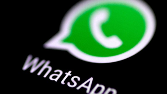 FILE PHOTO: The WhatsApp messaging application is seen on a phone screen August 3, 2017. REUTERS/Thomas White/File Photo