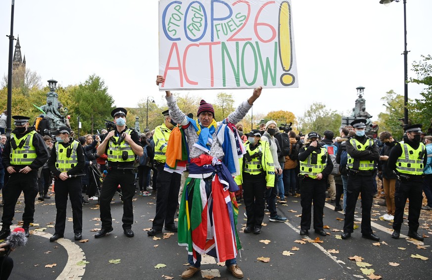 GLASGOW, SCOTLAND - NOVEMBER 05: A demonstrator joins the Fridays For Future march on November 5, 2021 in Glasgow, Scotland. Day Six of the 2021 climate summit in Glasgow will focus on youth and publi ...