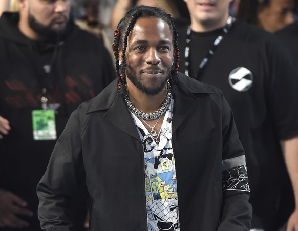 FILE - Kendrick Lamar arrives at the MTV Video Music Awards, on Aug. 27, 2017, in Inglewood, Calif. Rapper Lamar will headline Move Afrika: A Global Citizen Experience, a new initiative to establish a ...