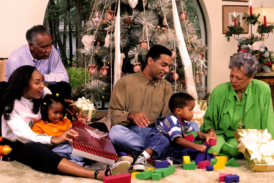 Affluent three generation black Afro-American family enjoy the giftgiving spirit of the Christmas season under the Christmas tree McPBBA McPBBA

Three Generation Black Afro American Family Enjoy The S ...