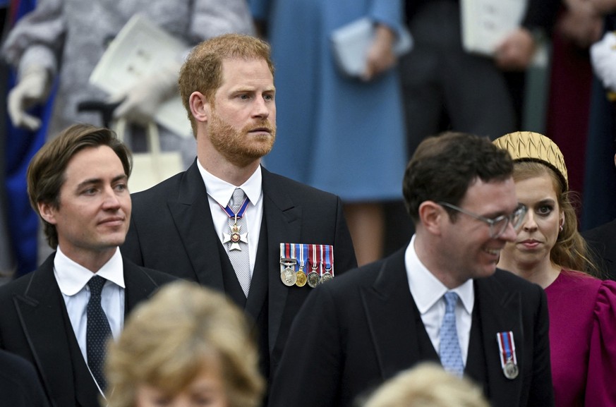 From left, Edoardo Mapelli Mozzi, Prince Harry Duke of Sussex, Jack Brooksbank and Princess Beatrice depart Westminster Abbey, London, following the Coronation of King Charles III and Queen Camilla, S ...