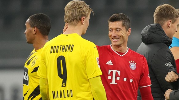 DORTMUND, GERMANY - NOVEMBER 07: Erling Haaland of Dortmund and Robert Lewandowski of Muenchen chat after the Bundesliga match between Borussia Dortmund and FC Bayern Muenchen at Signal Iduna Park on  ...